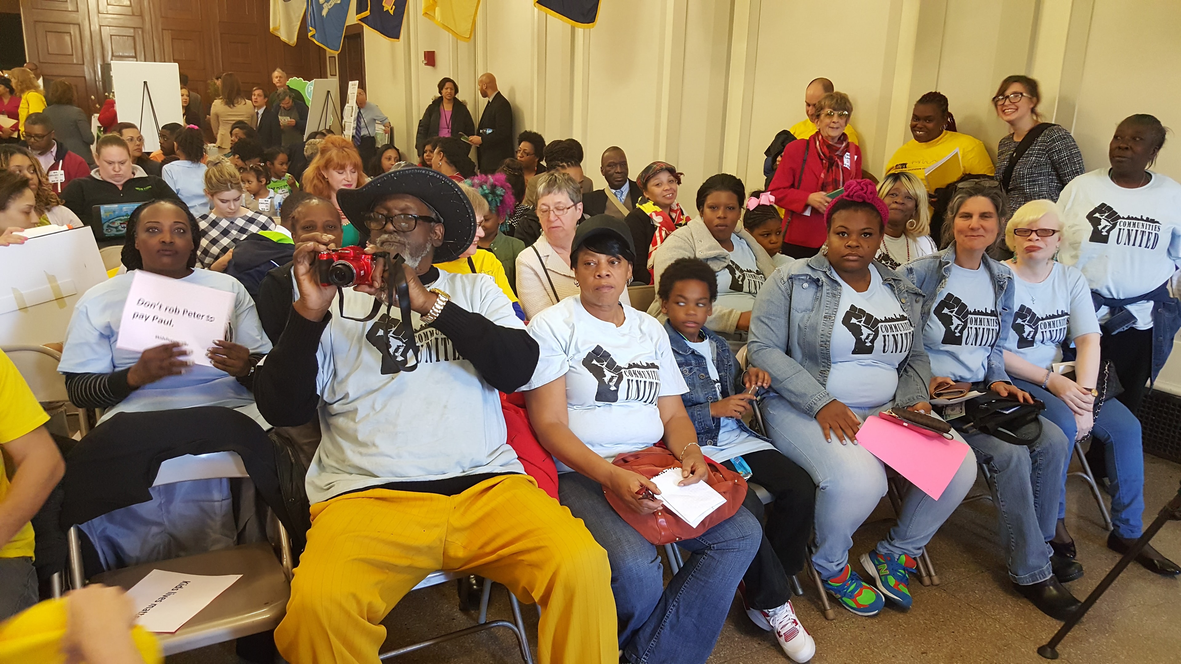 Community members gathered at an indoor advocacy event